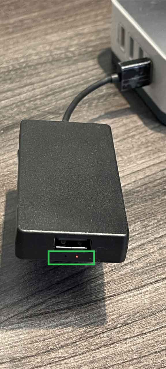 AACP dongle with red LED lit, indicating it is ready